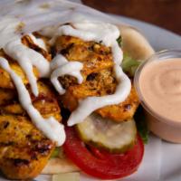 Chicken Kebab Gyro · Grilled chicken cubes marinated in our special spices, topped with your choice of regular ga...