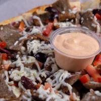 Lamb Gyro Pizza · One of our original recipes for meat lovers, made with slow-roasted lamb gyro, tomatoes, oni...