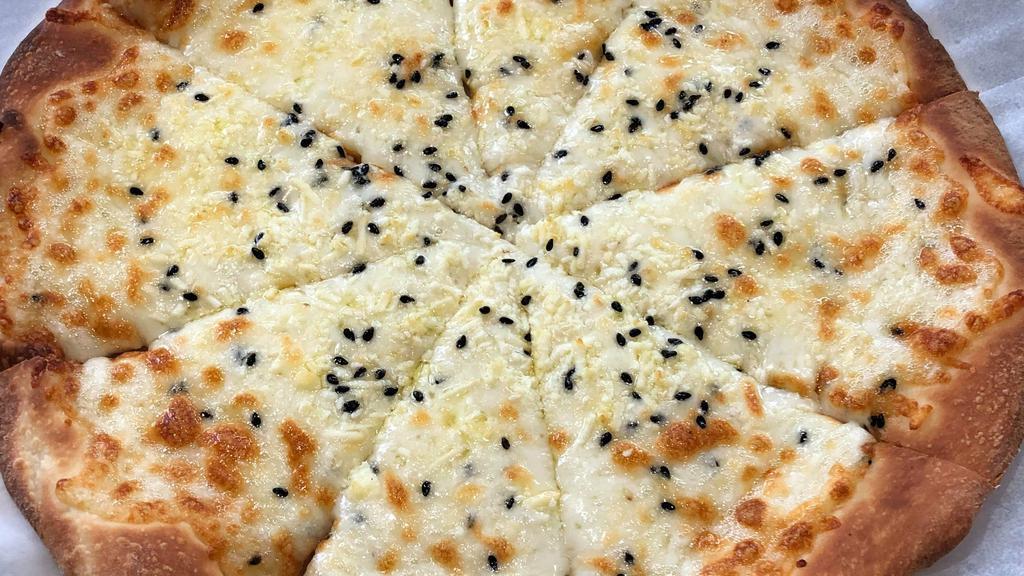 Dual Cheese Pizza · Our in house twist on a well renowned classic, made with Feta cheese, Mozzarella, sesame seeds, and olive oil.