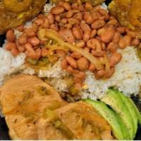 Pork Chops Guisado Plate · 2 boneless pork loin chops seasoned with Puerto Rican spices and slowly cooked in broth. Ser...