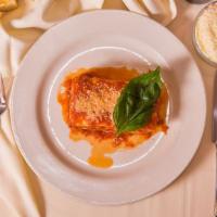 Lasagna Bolognese · Pasta layered with ground veal, mozzarella, ricotta, and parmesan cheeses baked in pomodoro.