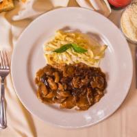 Veal Marsala · Sauteed veal scaloppini topped with mushroom marsala wine sauce and prosciutto. Served with ...