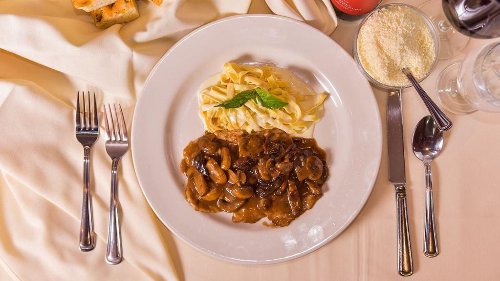 Veal Marsala · Sauteed veal scaloppini topped with mushroom marsala wine sauce and prosciutto. Served with fettuccine alfredo.