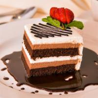 Infusione Di Cioccolato · Layers of brownie, milk chocolate mousse, and whipped cream.