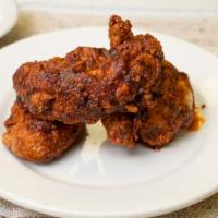 Nashville Fingers (3) · Crispy deep fried chicken tenders covered in our homemade Nashville sauce