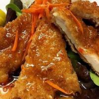 Lemon Chicken · marinated chicken breast,lightly deep fried, on bed of mixed salad,topped with sweet lime sa...
