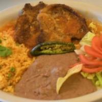 Pork Chops Ranchera · Rice, beans, salad, two tortillas and guacamole.