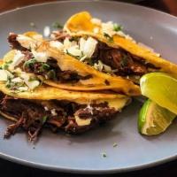 Birria Tacos · Three braised beef birria tacos stuffed with chihuahua cheese, comes with a side of consomme...