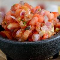 Chips Y Salsa · House made tortilla chips and fresh pico de gallo (diced tomatoes, red onion, serrano pepper...