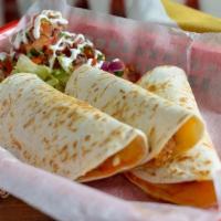 Asada Quesadilla · Slow cooked steak folded with melted cheese into a flour tortilla.  Served with lettuce, pic...