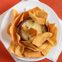 Spinach Artichoke Dip · Creamy parmesan sauce mixed with diced artichokes and chopped spinach. Served with tortilla ...