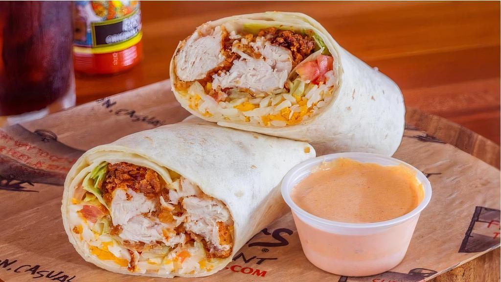 Rooster Wrap · Grilled or Fried Tenders rolled up in a fresh wrap with shredded lettuce, tomatoes and a blend of cheese. Served with Roosters Spicy Ranch or your choice of dressing on the side.
