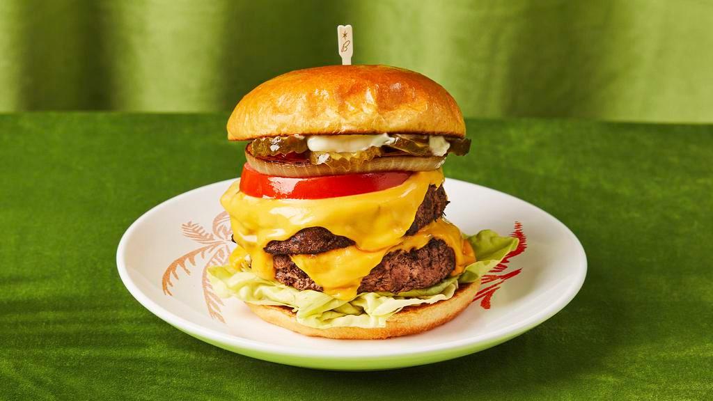 Double House Burger · Our special house cheeseburger with two patties, lettuce, tomato, onions and house sauce.