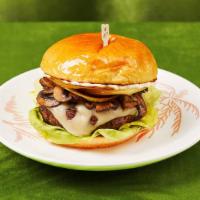 Mushroom Swiss Burger · Juicy burger with swiss cheese, mushrooms, onions, lettuce, and house sauce.