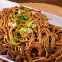 Tallarin Saltado Mixto · Homemade Peruvian stir-fried linguine sautéed with strips of chicken, steak, and red bell pe...