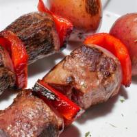 Sirloin Steak Skewers · Three beef tenderloin served with chupitos ahi and avocado salad.