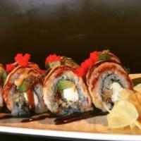 Dragon Roll (Cooked) · Grilled eel and cucumber inside, topped with fresh avocado and tobiko. served with eel sauce.