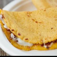 Quesadillas (2) · Two Corn Tortilla Quesadillas with grilled Cheese.