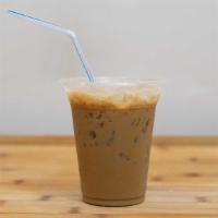 Vietnamese Iced Coffee · Dark french roast coffee and espresso poured over crushed ice and condensed milk.