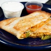 Chicken Quesadilla · A large, cheesy quesadilla with sizzling chicken, caramelized onions, and roasted bell peppe...