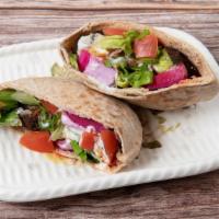 Falafel Sandwich (In Pita) · Falafel Freshly made from scratch
Toppings include:
Romaine lettuce, tomatoes, cucumber, red...