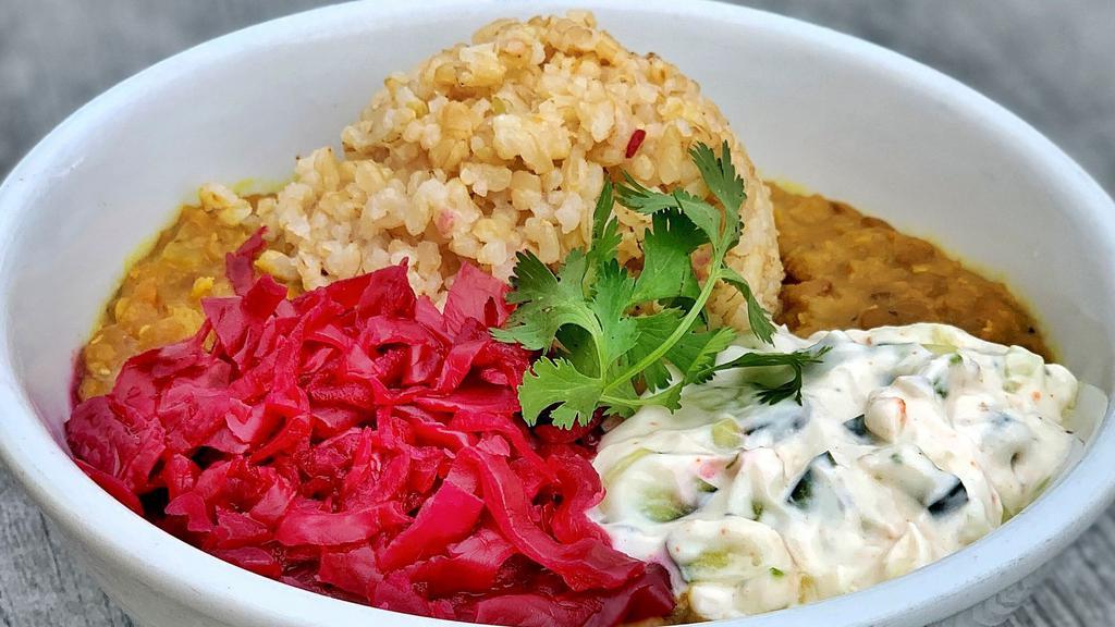 Adorabowl · Spiced red and green lentil dahl over brown rice with rich coconut yoghurt tzatziki, beets, red cabbage sauerkraut, and fresh cilantro. Macrobiotic, probiotic.