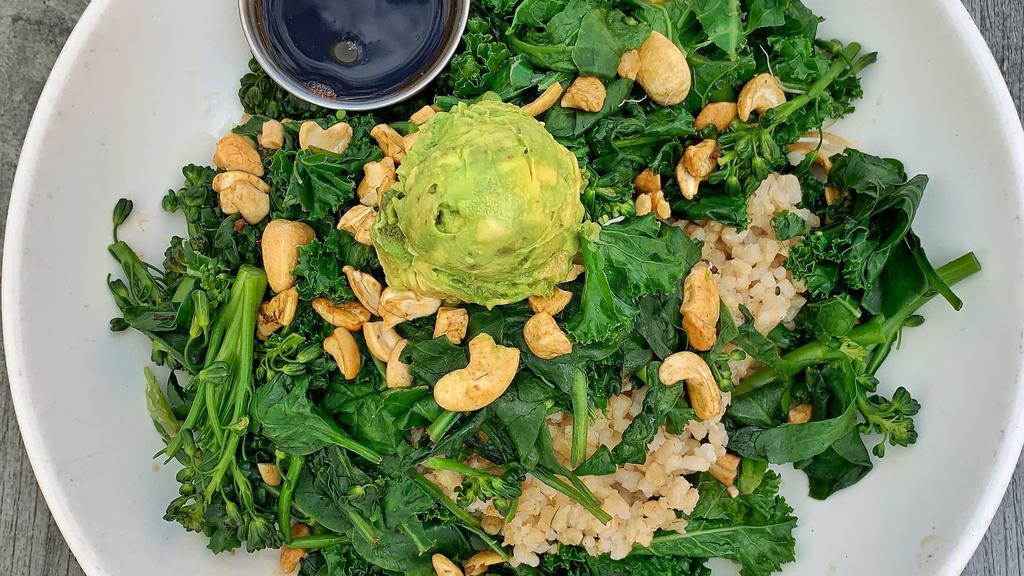 Nourish Green Bowl  · Broccolini, kale, spinach, avocado, coconut cashews, collard greens, and sunflower sprouts sauteed in pesto. All served over a bed of steamed brown rice, and topped with sour cream.