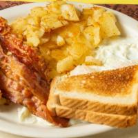 2 Eggs With Bacon · Served with choice of hashbrown, homefries or grits and a choice of toast, biscuit or Englis...