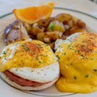 Eggs Benedict · Two poached eggs, ham and hollandaise served on English muffin.