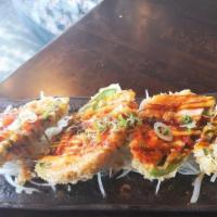 Spicy Salmon Popper S · Raw. Deep-fried jalapeno with cream cheese, spicy salmon and tobiko, scallion, and chef's sp...