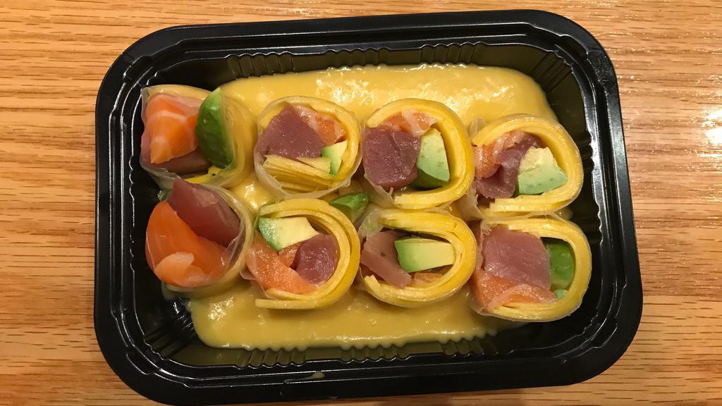 Mango Summer Roll S · No rice,tuna,salmon,avocado,mango,rolled with special rice paper,and mango sauce on top