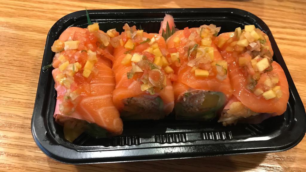Pink Lady Maki S · Raw. White fish, tuna, avocado, mango inside, topped with salmon, kani, spicy mayo, tobiko, and honey wasabi.