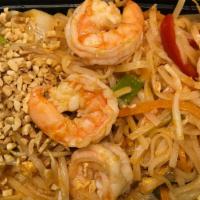 Pad Thai(Thai Style)白泰面 K · Stir fried flat rice noodle choice of tofu, beef, chicken,jumbo shrimp with green and red pe...
