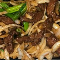 Mongolian Beef 蒙古牛 K · Slices of flank steak, stir-fried with mushroom, scallion and onion in an aromatic light bro...