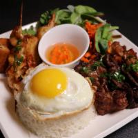 Combination Rice Plate - Com Dac Biet · Charbroiled pork, srimp skewers, crispy beancurd, eggroll, fried egg.