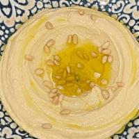 Hummus · Vegan. Cooked chickpeas, garlic, lemon juice, tahini, and olive oil.