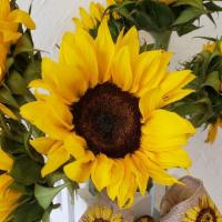 Sunflower Flower Arrangement Arranged In Large Vase  · Beautiful Sunflowers arranged in large glass vase. Six stems of Sunflowers, tied with  sunfl...