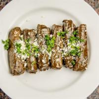 Stuffed Grape Leaves · Grape leaves filled with a mix of rice, parsley, tomatoes. Poached in fresh lemon juice and ...