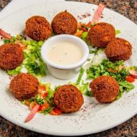 Falafel · Deep fried vegetarian patties made of a mix of chickpeas, fava beans diced onions and garlic...