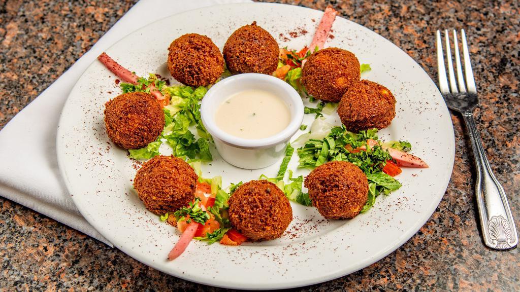 Falafel · Deep fried vegetarian patties made of a mix of chickpeas, fava beans diced onions and garlic served with tahini sauce.