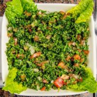 Tabouleh Salad · A mix of chopped parsley, diced tomatoes, diced onions, and cracked wheat tossed in fresh le...