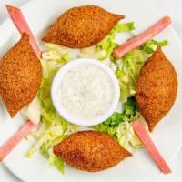 Fried Kibbeh · Deep fried Angus ground beef and cracked wheat shells, stuffed with a mix of Angus ground be...