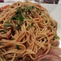 Tallarin Saltado De Pollo · Spaghetti and fresh chicken sautéed in olive oil, red peppers, red onions, tomatoes, and fre...