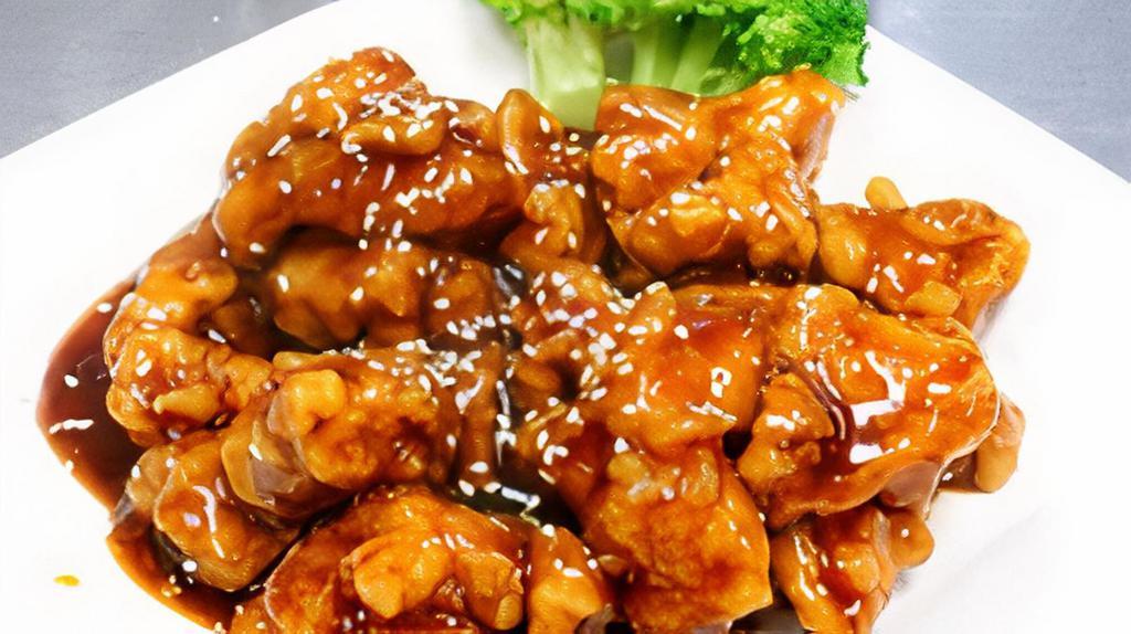 Sesame Chicken · Fried battered chicken stir-fried with sesame sauce with broccoli.