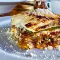 Lasagna Alla Bolognese · Traditional bolognese sauce and homemade bechamel layered in egg dough pasta, baked in the o...