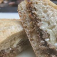 Philly Cheesesteak · Shredded beef, grilled onions, provolone cheese on ciabatta roll.