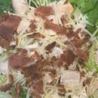 Chicken And Bacon Caesar · Romaine Lettuce, fresh baked chicken, bacon, and parmesan cheese tossed in our creamy Caesar...