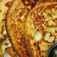 Vanilla French Toast · Two slices of white bread soaked in egg vanilla and cinnamon suger