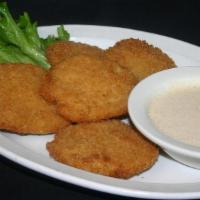 Fried Green Tomatoes · Our Signature Panko Breaded Fried Green Tomatoes served with our Signature Creek Sauce.