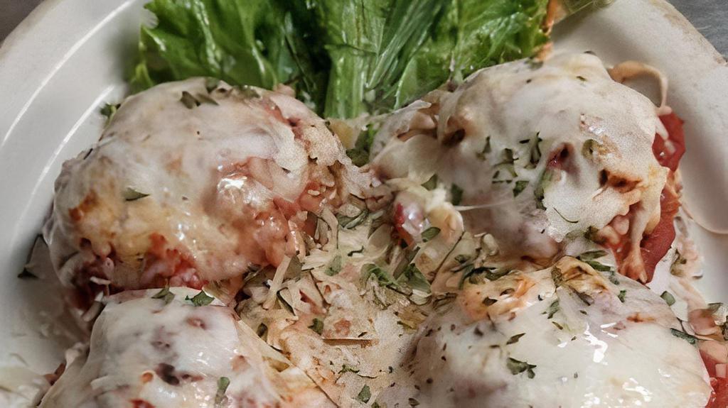 Goose Creek Meatballs · Homemade Italian Meatballs served on Fried Green Tomatoes and topped with Marinara, Mozzarella and Parmesan Cheeses.